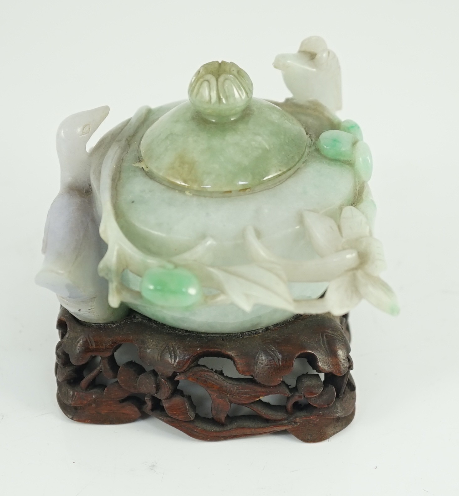 A Chinese lavender and green jadeite water pot and stand, late 19th century, 9.3cm at widest point, wood stand